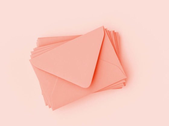 stack of card envelopes awaiting addresses