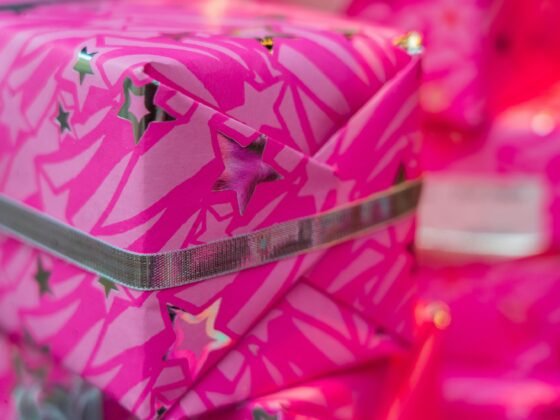 holiday gift wrapped in hot pink wrapping paper