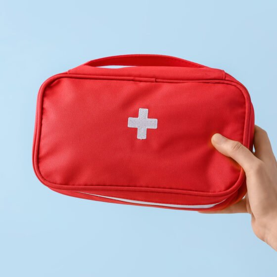 travel medicine kit being held by a woman